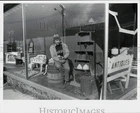 1979 Press Photo Dick Fortin Store Front Window Watching Clean Up From Fire. Unspecified. Price: $24.99.